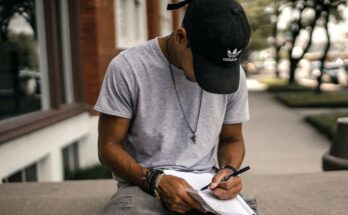 Person journaling about financial goals symbolizing clarity and growth.